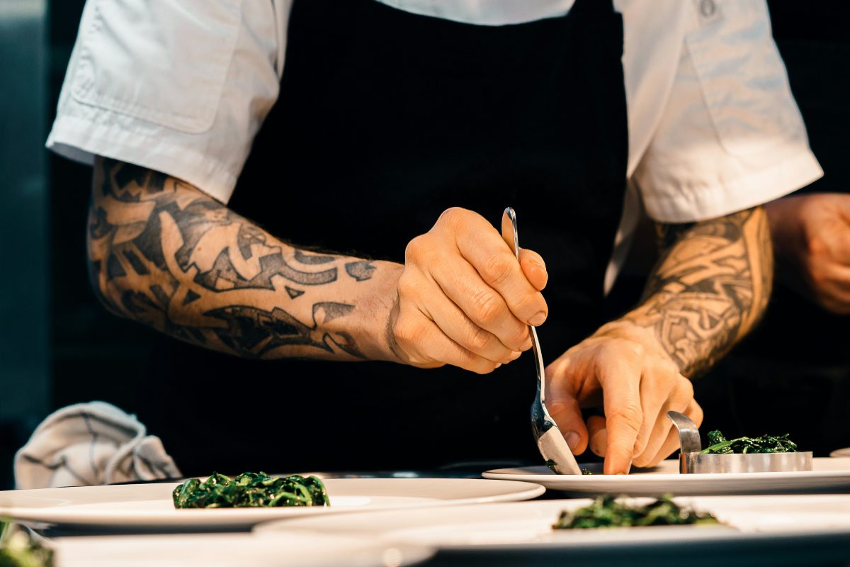 Chef plating entrées for wedding dinner service